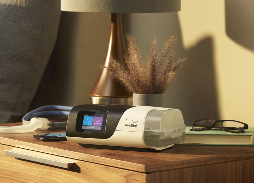 ResMed AirSense 11 CPAP machine set up on a bedroom nightstand